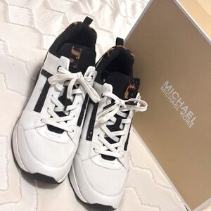 Micheal kors wedge leopard sneakers. Gently used. Worn twice. Smoke free home.